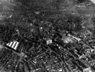 Aerial view - City Centre including (from left to right), Sheffield Corporation Tramway and Omnibus Depot, Tenter Street / Hawley Street (left), Central Telephone Exchange, Trippet Lane / West Street (centre), City Hall under construction and Church 