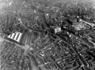 Aerial view - City Centre including (from left to right), Sheffield Corporation Tramway and Omnibus Depot, Tenter Street / Hawley Street (left), Central Telephone Exchange, Trippet Lane / West Street (centre), City Hall under construction and Church 