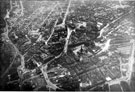Aerial view - City Centre after the Blitz including Cathedral, Church Street, centre, Fargate, High Street, Angel Street and West Bar in foreground, Sheffield Corporation Tramway and Omnibus Depot, Tenter Street, right and Fitzalan Square and Pond St