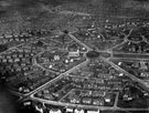 Aerial view - Manor Estate, roads including Windy House Lane, Wulfric Road (through centre), Fitzhubert Road and City Road (bottom of picture), showing St. Swithun's Church and  Stand House Council School, Queen Mary Road