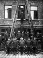 View: s12473 Firemen including Superintendent William Frost (front row centre) and a horse drawn steam boiler outside Rockingham Street fire station