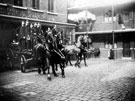 View: s12475 Horse drawn steam fire engines outside Rockingham Street fire station showing fireman's flats