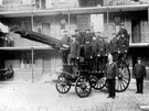 View: s12476 Group of firemen including Superintendant William Frost with a horse drawn fire engine outside Rockingham Street fire station showing (back) Firemans flats