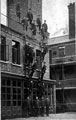 View: s12497 Firemen on training exercise early 1900's outside Rockingham Street fire station showing the Firemen's Flats