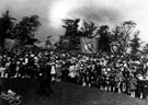 Sunday School congregations in front of their church banners at the annual Whit-Monday and Hymn Singing Festival of Joy in Firth Park including Grimesthorpe Wesleyan Sunday School