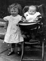 Marjorie Bullivant and younger brother, N.B. wooden chair
