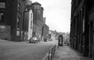 Arundel Street from junction with Surrey Street, premises on left include Army Recruiting Office (former School of Medicine) and Sunday School belonging to Surrey Street United Methodist Free School (with turret), College of Technology, right