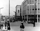 View: s13070 Angel Street and Market Place from High Street, Nos.  51 - 57, Peter Robinson Ltd., department store and Horne Brothers Ltd., outfitters with the Vulcan Sculpture by Boris Tietze