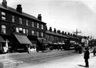 Attercliffe Road showing shops including No. 545 Wm. Jn. King, provision dealer, Entwistle, tailors and Son, Midland Railway receiving office