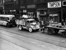 Traffic on Attercliffe Road with shops: Watts and Co., A. Jennings and Sons Ltd., Kays and Timpsons visible Traffic on Attercliffe Road with shops: Watts and Co., A. Jennings and Sons Ltd., Kays and Timpsons visible