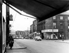 Attercliffe Road with the junctions of Sleaford Street and Staniforth Road, with properties including Halfords Cycle Co. Ltd., Easiphit (Greenlees and Son) Ltd. and Littlewoods