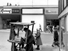 Ernest Shaw, street seller on Attercliffe Road with No. 655 Rentaset, television rental shop in the background