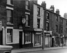 Shops including, No. 22 G.C. Hawkins, grocer and off licence, I. Stokes, hairdresser, K. Barton, grocer and Mrs. R. Waterfall, grocer, Barrow Road, Low Wincobank