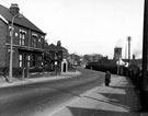 Bawtry Road showing H. Collins, grocers at the junction of Greasbro Road showing the cooling towers and gas holders in the background