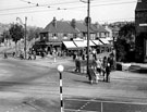 Shops including Priestley and Styan, (C.E. Styan Ltd.) bakers and Jsph. H. Watson, butchers, Bellhouse Road looking across Firth Park Road with Sicey Avenue in view