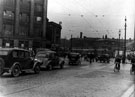 Exchange Street looking towards Blonk Street (note hold-up of trams), No. 37 Exchange Street, W.H. Smith and Son Ltd., booksellers, Hambleden House and Alexandra Hotel