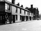 Mrs. M. Clay's corner shop No. 57 Russell Street, Bowling Green Street looking towards Moorfields showing Sheffield College of Technology, Department of Science and Metallurgy, Lancastrian Annex, extreme right (former Lancasterian School)