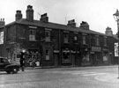 View: s13700 Bramall Lane at junction of Hermitage Street, No. 30 Jn. Goodison, hardware dealer, No. 26 Mrs Alice Holmes, tripe dresser, Nos. 22 - 24 H. Slater and Son, mill furnishers