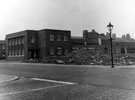 View: s13705 Demolition of buildings on Bramall Lane, Remploy Ltd., engineers on left