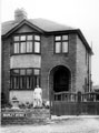 Nellie Oliver (wife of A. Oliver, butcher), in garden of No. 1 Bramley Avenue, Handsworth