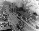 Fire on Broad Street, most probably at the rope and twine works belonging to J.H. Mudford and Sons Ltd., showing No. 67 Old Blue Ball public house on corner