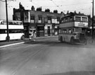 Buses and shops including, Joseph Laycock, watch repairer, R.V. Butcher, fruitier, Margaret Ardern School of Dancing and T. Ardern and Son Ltd., builder, Spital Hill near the junction of Earsham Street taken from Burngreave Road