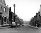 View: s14084 No. 76 Sedan Street and Nos 13, 15, 17 etc (left), Nos. 12,18,20 etc. (right) Canada Street, Burngreave looking towards Petre Street