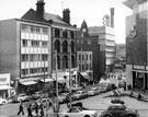 View: s14175 Castle Street looking towards Castle Market, Brightside and Carbrook (Sheffield) Co-operative Society, Castle House, right, shops on left include, No 5, Kennings Ltd., motor car accessories and No. 7 H. Turner and Son Ltd., newsagents