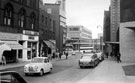 Castle Street looking towards Castle Market, Brightside and Carbrook (Sheffield) Co-operative Society, Castle House, right, shops on left include, No. 11 Sugg Ltd., cycle dealers