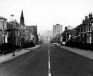 General view of Cemetery Road including Vine Inn and Cemetery Road Congregational Church on left, Lansdowne Flats in distance