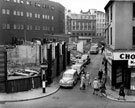 Demolition of buildings on Change Alley, photographed from Norfolk Street, No. 18 Norfolk Street, J.W. Thornton Ltd., confectioners on right