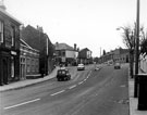 Common Side, from Springvale Road junction, looking towards Sydney Road and Barber Road, Springvale Hotel on left, No 21, G. Worrall, chemist and Midland Bank Ltd. in distance