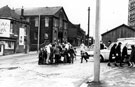 Fetching water from the stand pipes on Cricket Inn Road, extreme left, grocer and off license No. 61, St. John's School, centre, and the junction of St. John's Road, right