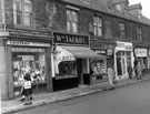 Crookes including No. 209 N. Nettleship, leather goods; No. 211 William Talbot, butcher; No. 213 W. Johnson, confectioner; No. 215  Abbey Glen Laundry Co. Ltd.; No. 217 W. Hughes, fruit and grocer