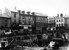 Dixon Lane looking towards Haymarket, during excavations for Woolworth's building (site of Norfolk Market Hall), including Nos. 2/4a Philip Cann, music seller, No. 6 H.C. Sayer and Son Ltd., butchers and No. 8 S.M. Parry, Ltd., fruiterers Dixon Lane looking towards Haymarket, during excavations for Woolworth's building (site of Norfolk Market Hall), including Nos. 2/4a Philip Cann, music seller, No. 6 H.C. Sayer and Son Ltd., butchers and No. 8 S.M. Parry, Ltd., fruiterers