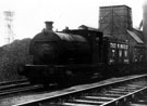 View: s15047 Colliery Engine 'Birley No. 6, Peckett 0. 4. 0 St' and Coal Wagons at Brookhouse Colliery with Water Cooling Tower in the background
