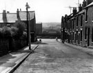 Eben Street looking towards Holywell Road and Brightside County School showing Brightside Post Office, No. 2-4 Lincoln Street (left), B and C Co-op at the bottom of Eben Street (right)