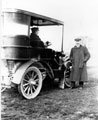 Mr. Warren (driving) and Studebaker car, registration no. D 10 78, Mr. Lucus, standing