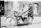 Mr and Mrs Jennings on their motorcycle outside Townhead Street Flats