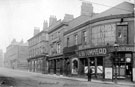 View: s15473 Exchange Street from Furnival Road to Exchange Lane (foreground), including No. 57 John C. Broomhead, hairdresser, No. 55 J.H. Mudford and Sons, rope and twine manufacturers, Nos. 51 - 53 Durham Ox public house