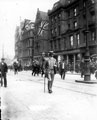 View: s15546 Fargate looking towards High Street, 1900-1905, possibly decorated for the Coronation Celebrations of King Edward VII, August 1902, including No. 13 John Thorpe Ltd., confectioners and Nos. 11 - 15 Goldsmith's Chambers in background