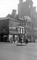 View: s15549 Fargate from Town Hall Square, including No. 70 Sheffield Creameries Ltd. (corner of Leopold Street) and No 68, Loxley Brothers Ltd., printers, No 66, Fleur de Lys public house (Bovril sign), Bank Chambers, right