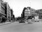High Street looking towards Fargate, site of Cole Brothers, department store, right, No. 2 High Street, Barclays Bank Ltd., Fargate Court and Marks and Spencer, left