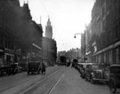View: s15594 Fargate, 1955-1960, Cole Brothers, department store right, No. 15 T.C. Palmer Ltd., tailors, Independent Offices (Fargate House) and Victoria House (including Nos 27/29, John Atkinson Ltd), left