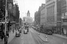Fargate looking towards High Street, including Victoria House, Nos. 33 - 35 James Woodhouse and Son, house furnishers and No. 37 Thomas Cook and Son Ltd., travel agents