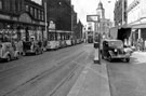 Fargate looking towards High Street and Kemsley House, Nos. 16 - 30 Robert Proctor and Son, drapers and Cole Brothers, department store