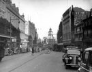 Fargate looking towards High Street and Kemsley House, including (right), Nos. 33 - 35 James Woodhouse and Son, house furnishers, Nos. 41-43 W.P. Kenyon, estate agents and John Walsh Ltd., department store,