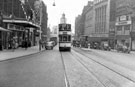 Fargate looking towards High Street including Nos. 38 - 40 Arthur Davy and Sons, provision dealers and Victoria Cafe, left, Nos.33-35, James Woodhouse and Son, house furnishers, Nos. 41-43, W.P. Kenyon, estate agents, right