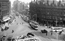 View: s15656 Elevated view of Town Hall Square looking towards Fargate showing tram and parked car holding up a long stream of traffic, Town Hall Square Rockery, foreground, Bank Chambers, left, Carmel House, Albany Hotel and Yorkshire Penny Bank, right
