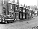 Nos. 115 - 131 Fawcett Street looking down towards E. Gower's grocers shop at the junction of Bromley Street